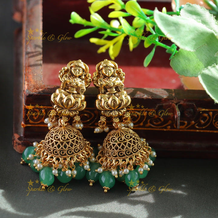 Exclusive Lakshmi peacock carved haram with ruby emerald and multi layer mint green beads chain
