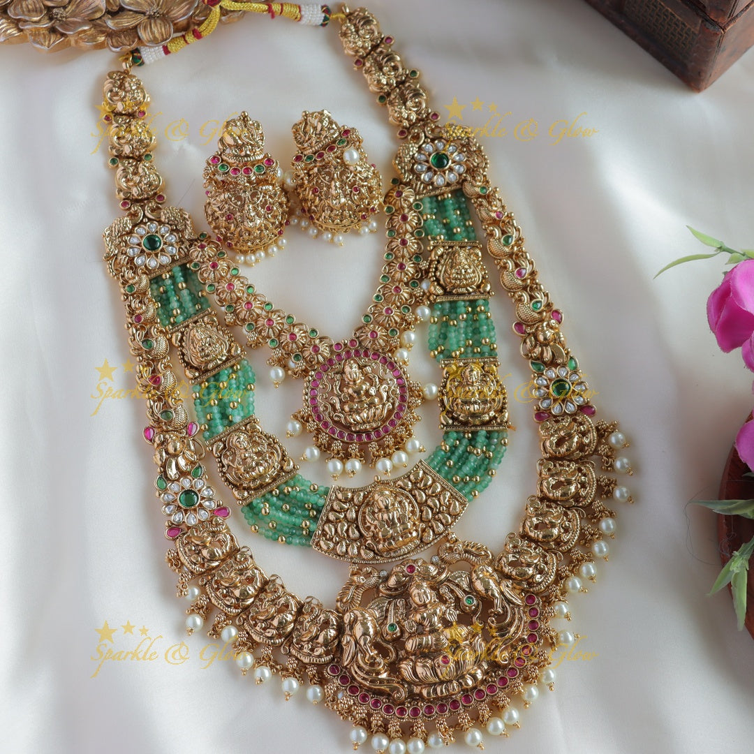 Grand Bridal Lakshmi peacock carved three layer haram with ruby emerald pearls and multi layer mint green beads