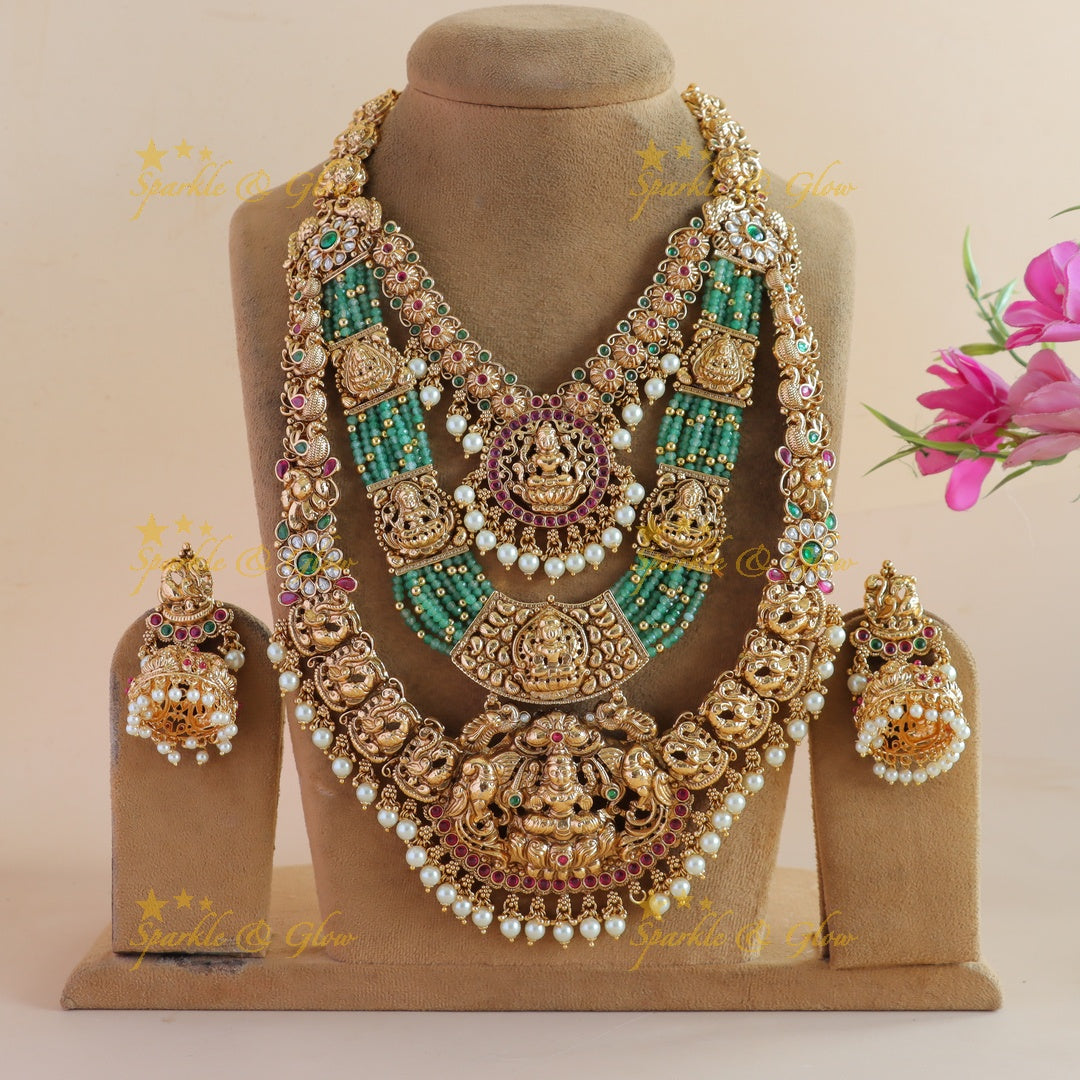 Grand Bridal Lakshmi peacock carved three layer haram with ruby emerald pearls and multi layer mint green beads