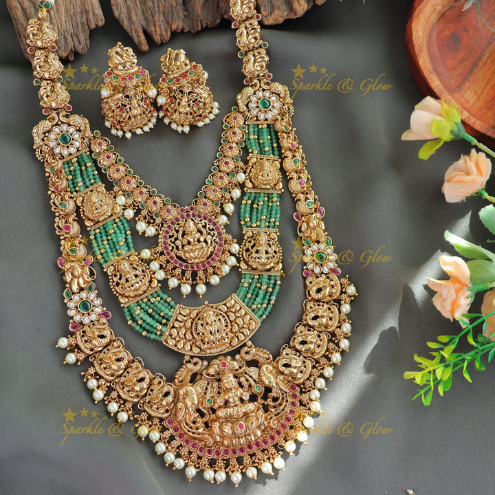 Grand Bridal Lakshmi peacock carved three layer haram with ruby emerald pearls and multi layer mint green beads