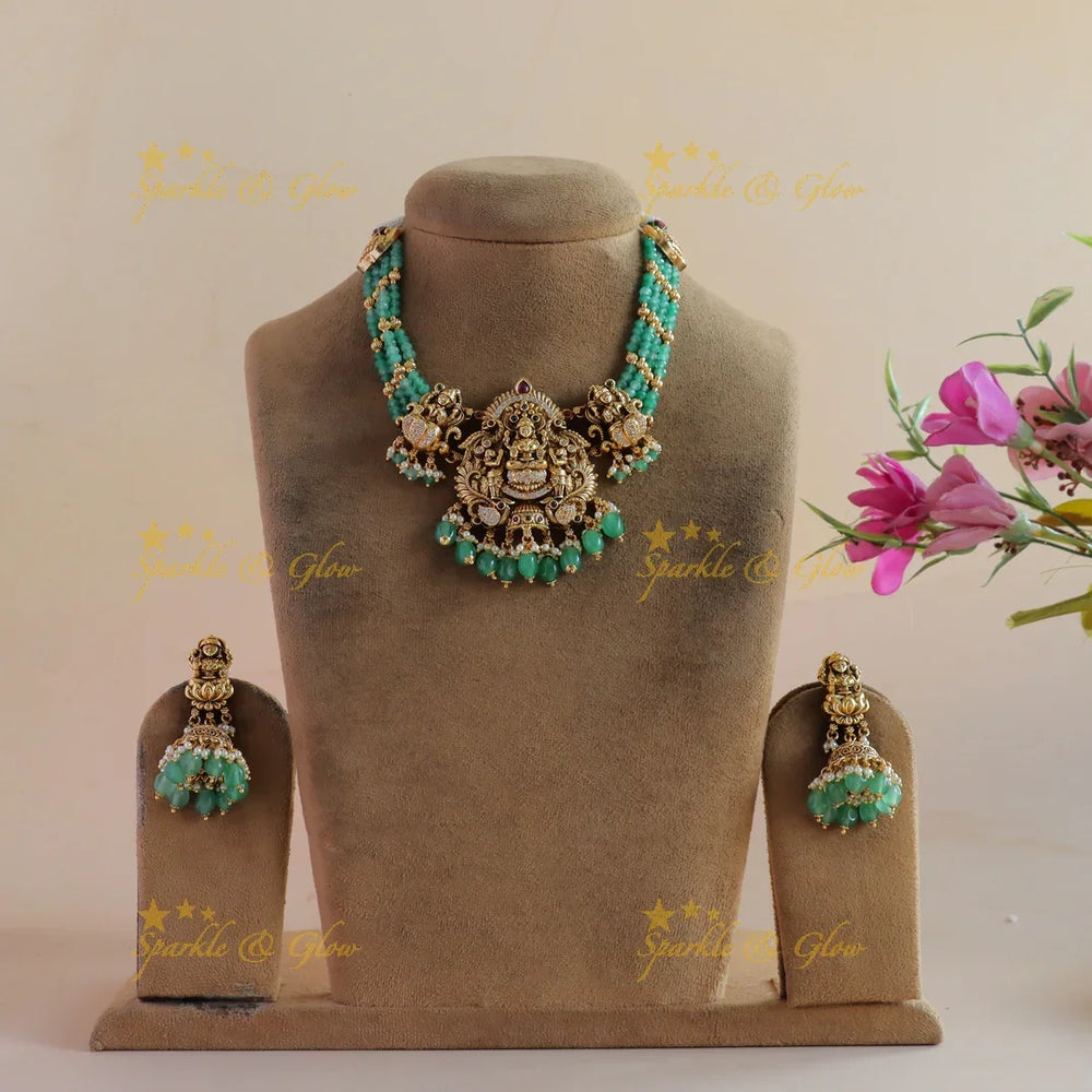 Statement Lakshmi peacock carved short necklace with multi layer mint green beads - Sparkle and Glow