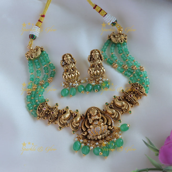 Elegant Lakshmi peacock carved short necklace with multi layer mint green beads and CZ stones