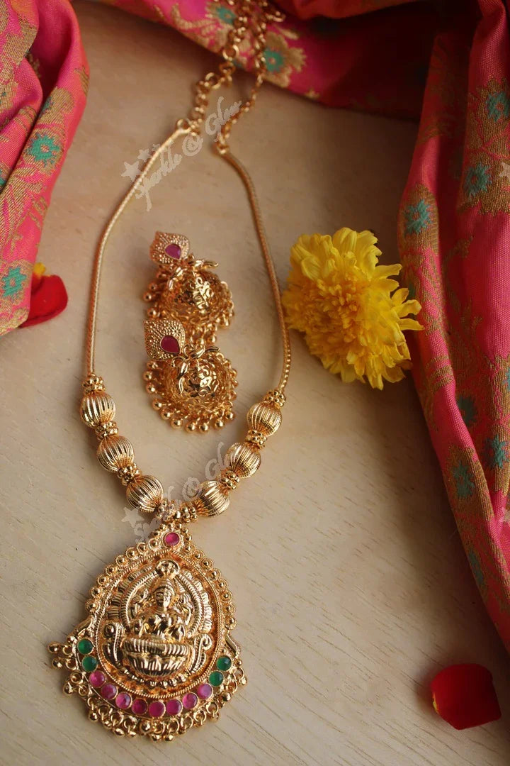 Elegant gold polished Lakshmi neckalace set - Sparkle and Glow