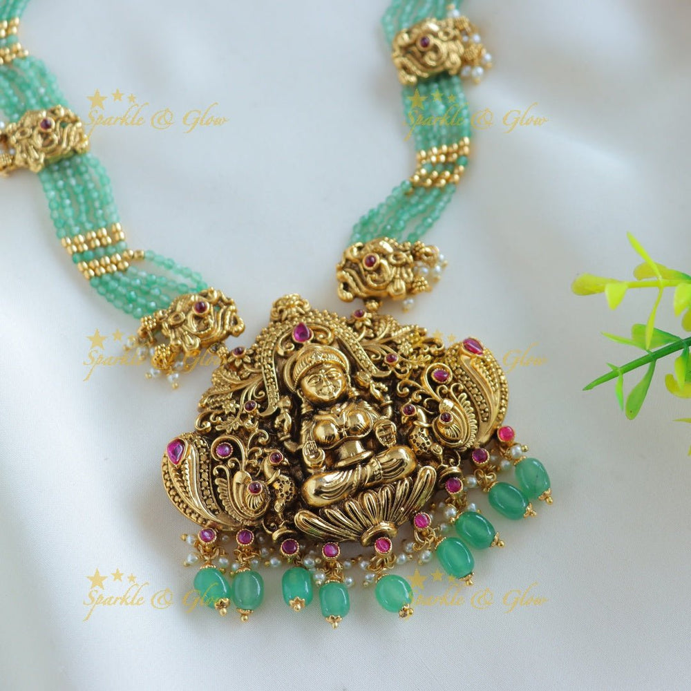 Grand Idol Lakshmi Peacock pendant Haram with multilayered mintgreen beads - Sparkle and Glow - 