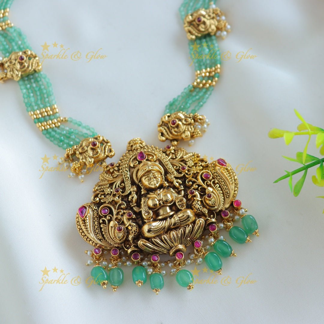 Grand Idol Lakshmi Peacock pendant Haram with multilayered mintgreen beads - Sparkle and Glow - 