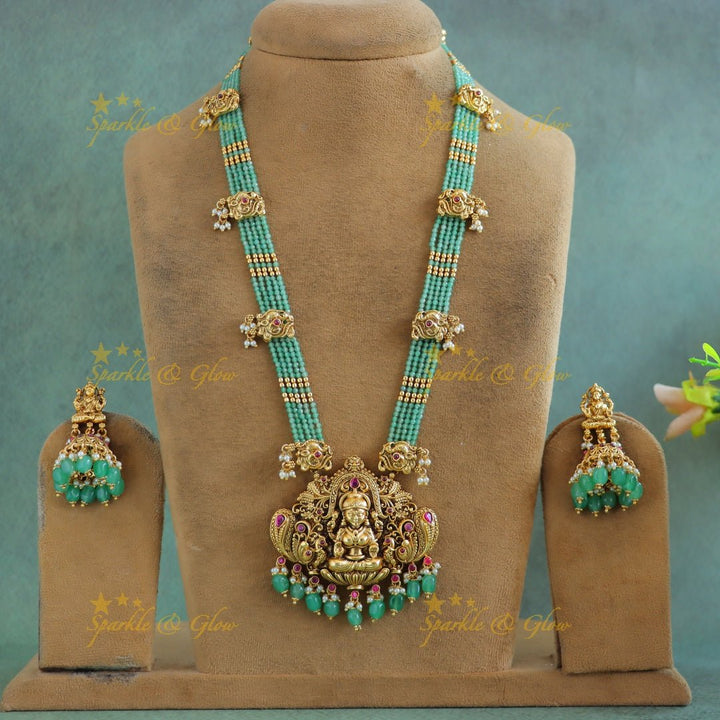 Grand Idol Lakshmi Peacock pendant Haram with multilayered mintgreen beads - Sparkle and Glow - 