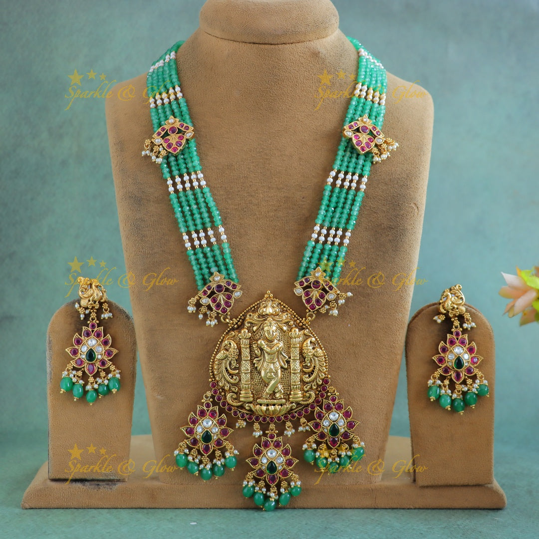 Grand Idol Krishna and Dancing peacock Haram with multilayered mintgreen beads