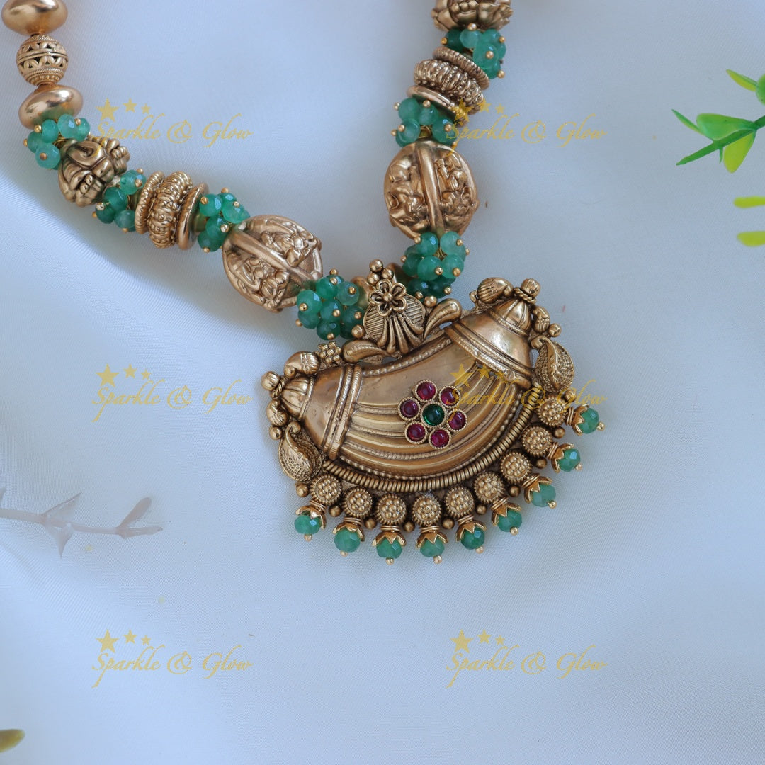 Intricately carved Gold ball beaded floral pendant short necklace with green beads