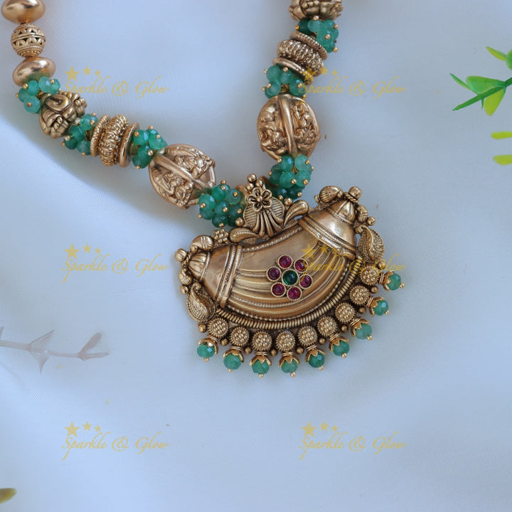 Intricately carved Gold ball beaded floral pendant short necklace with green beads