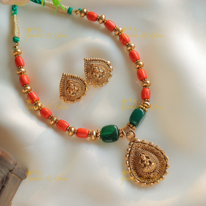 Statement Idol Lakshmi pendant carved short necklace with coral and green beads