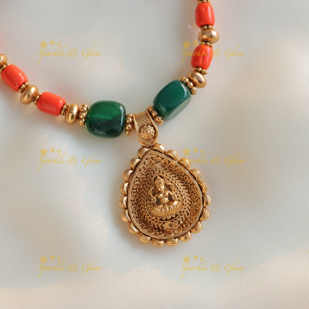 Statement Idol Lakshmi pendant carved short necklace with coral and green beads