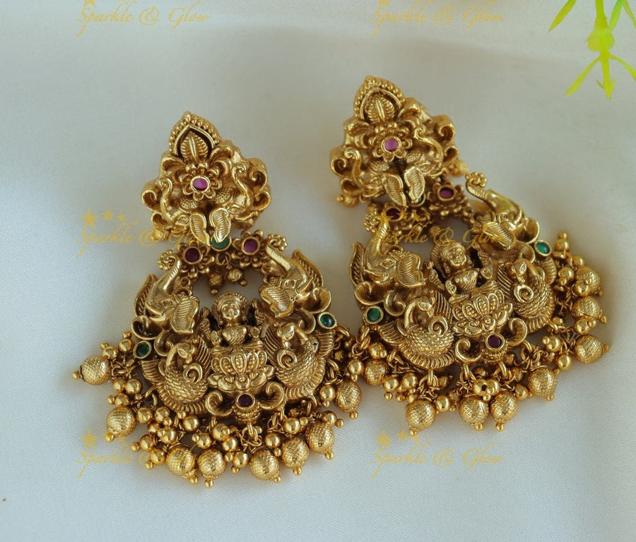 Gracious Idol Lakshmi Peacock carved Bali design Earrings - Sparkle and Glow - 