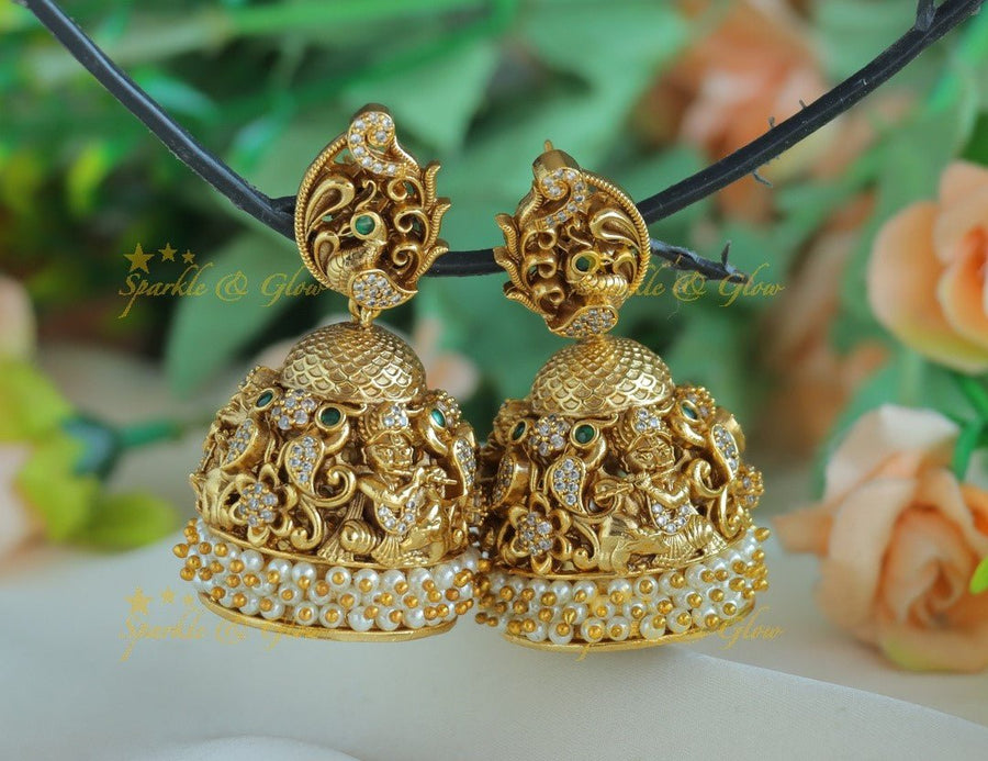 Beautiful Idol Flute Krishna carved Peacock Jhumka - Sparkle and Glow - 