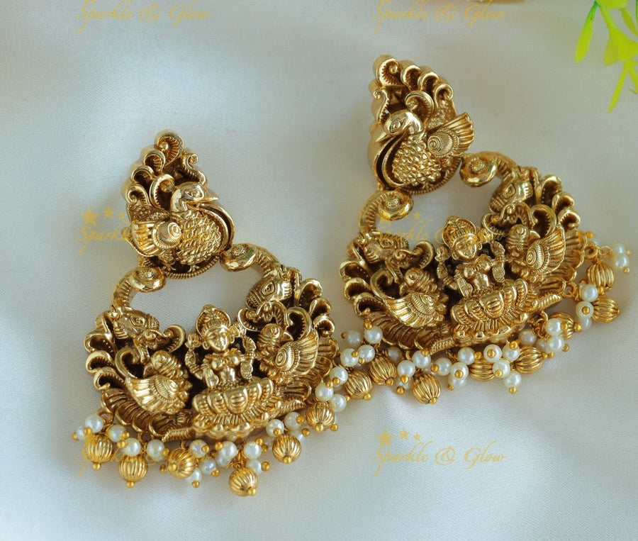 Beautiful Idol Lakshmi Peacock carved chandbali with pearls and gold beads - Sparkle and Glow - 
