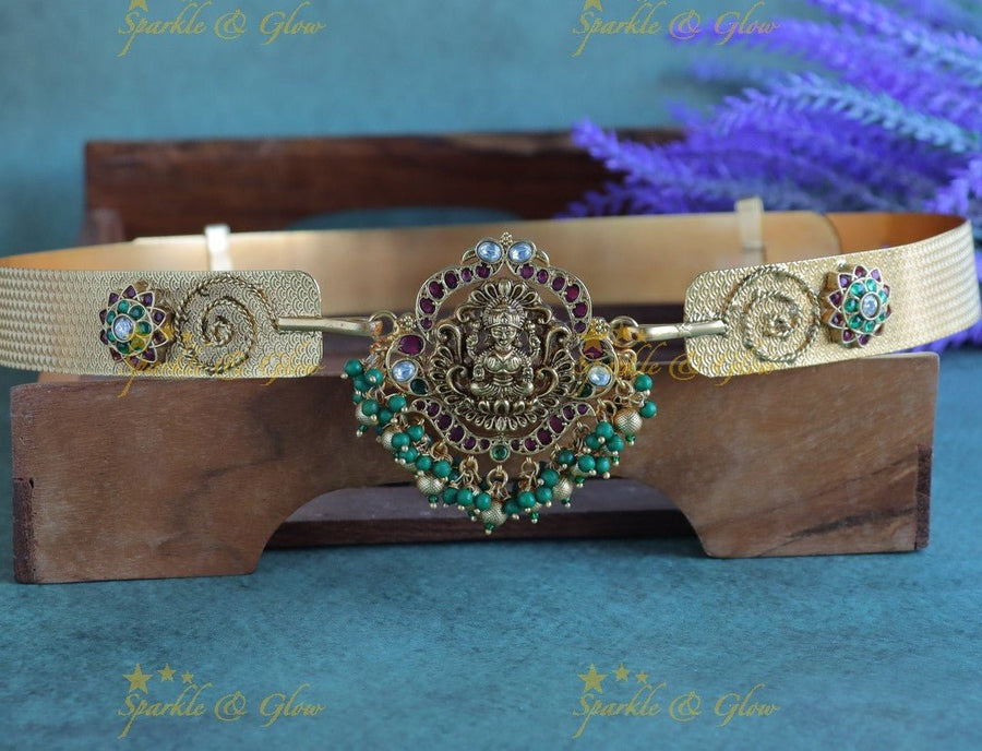 Gracious Idol Lakshmi Peacock pendant carved Sunflower design hipbelt with green and gold beads - Sparkle and Glow - 