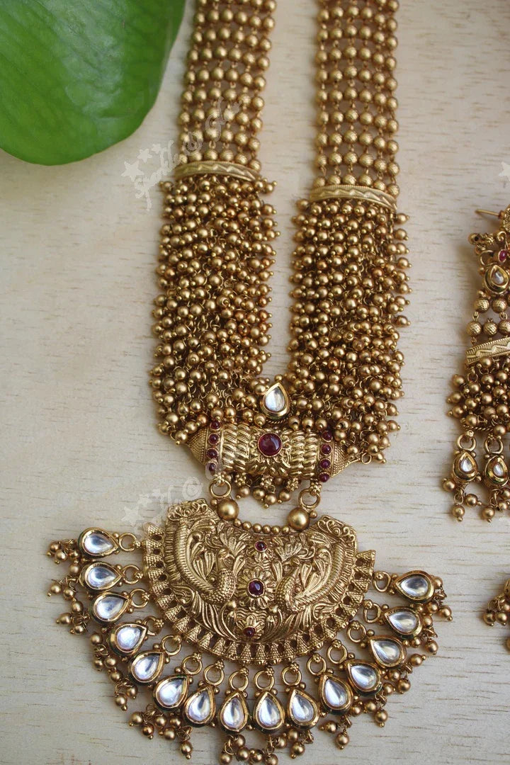 Statement gold bead cluster kundan stone peacock carved pendent haram - Sparkle and Glow