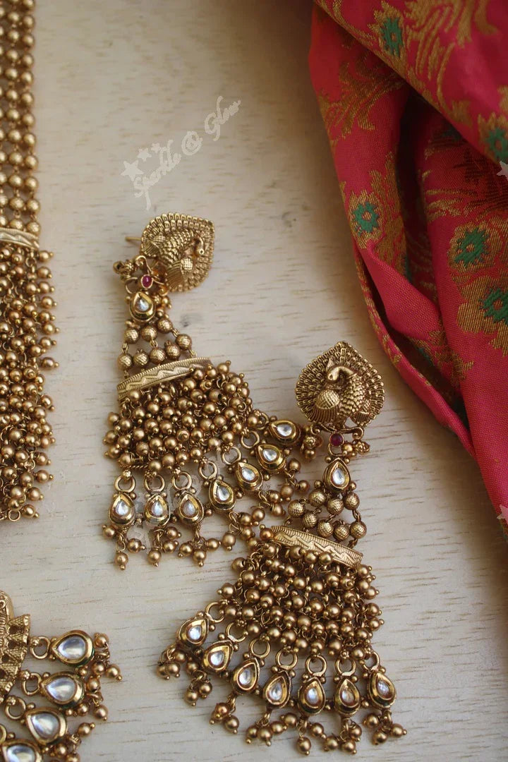 Statement gold bead cluster kundan stone peacock carved pendent haram - Sparkle and Glow