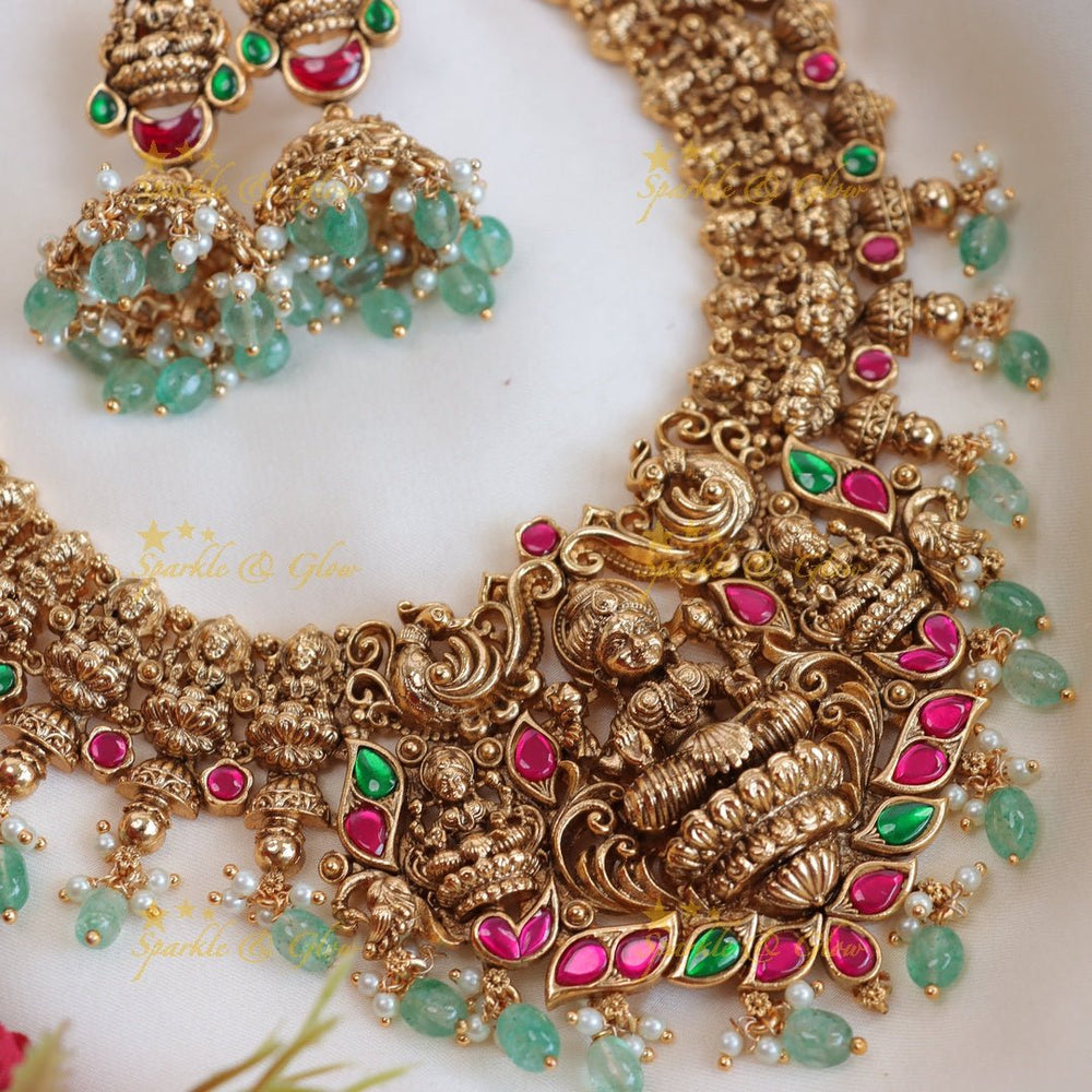 Beautiful Gold alike lakshmi and peacock design with mint green beads long necklace - Sparkle and Glow