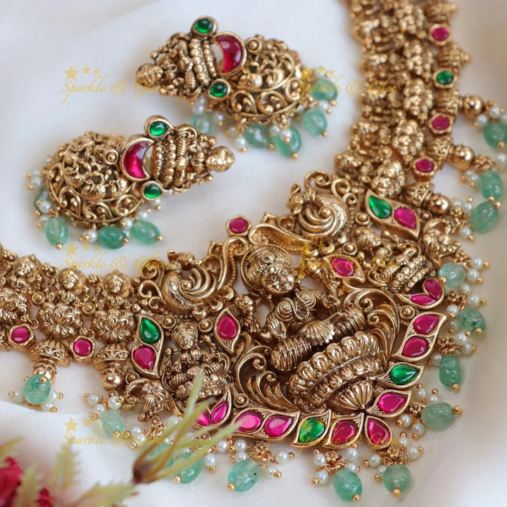Beautiful Jadau lakshmi and peacock design with mint green beads short necklace - Sparkle and Glow