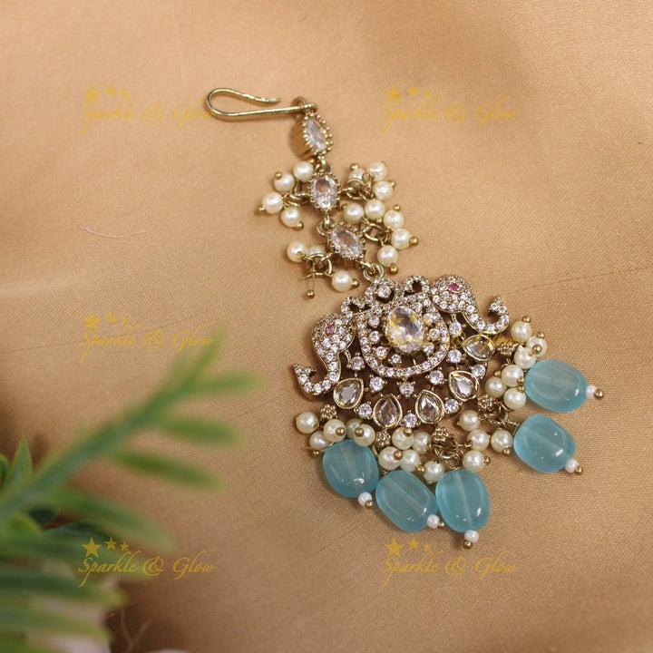 Sparkling Dual tone Elephant Floral Guttapusalu Victorian AD Maangtikka - Sky blue - Sparkle and Glow - Sky blue - 