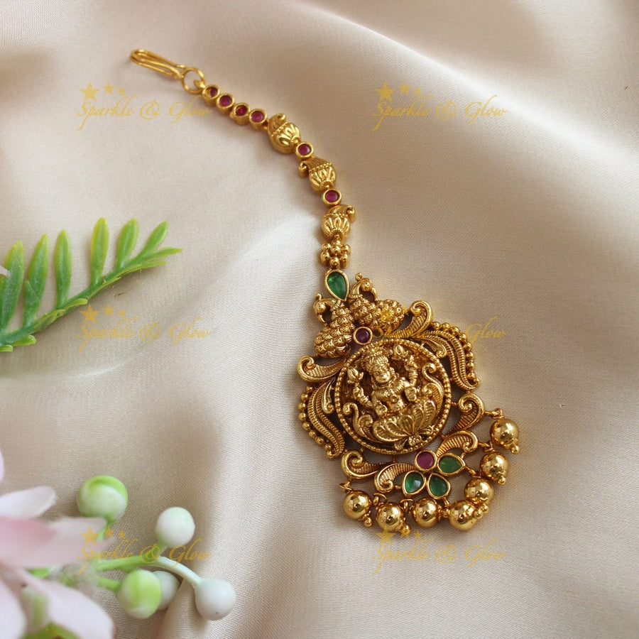 Statement Dual tone Peacock Lakshmi carved single line maangtikka - Sparkle and Glow - 