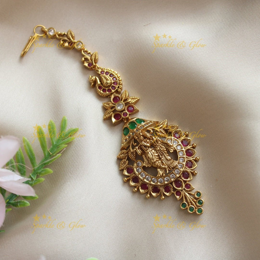 Statement Idol Radhakrishna Peacock carved single line maangtikka - Sparkle and Glow - 