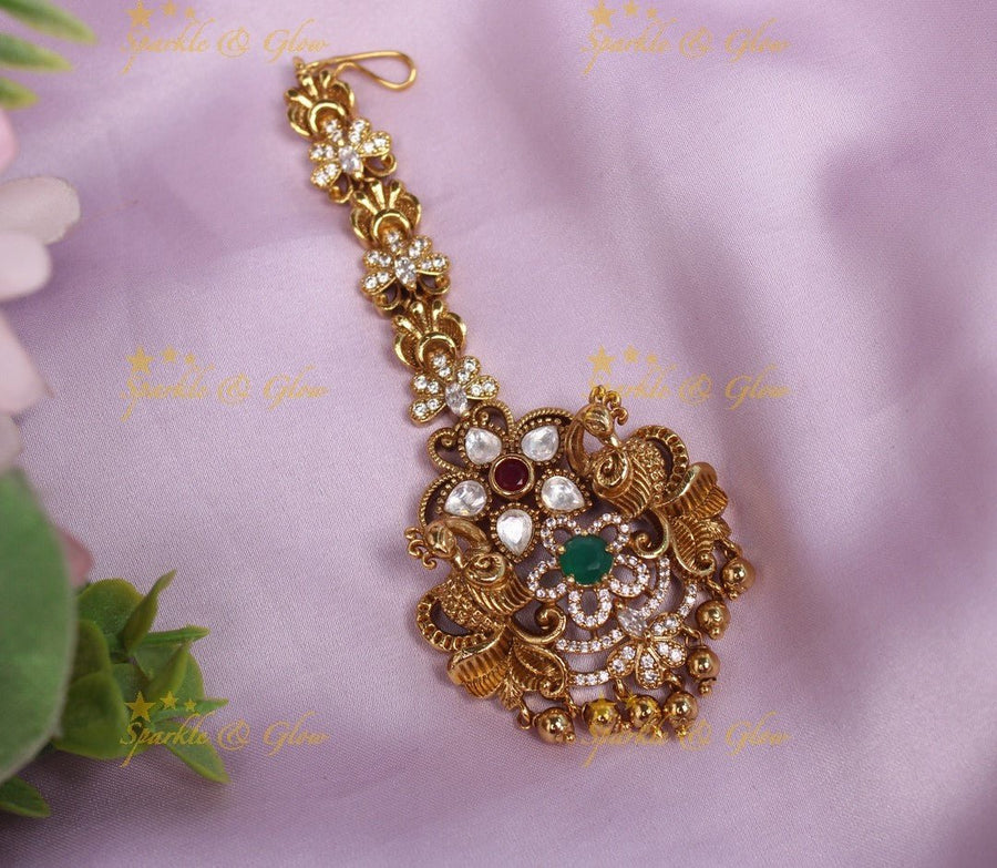 Beautiful Dual tone Peacock Floral Maangtikka with AD stones - Sparkle and Glow - 