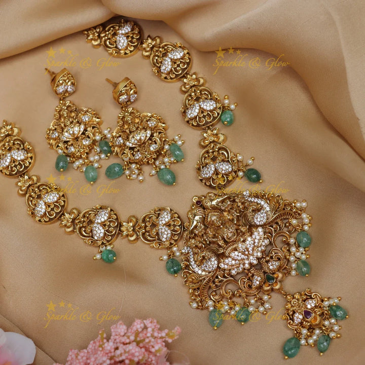 Elegant lakshmi and peacock design short necklace with cz stone - gold - Sparkle and Glow