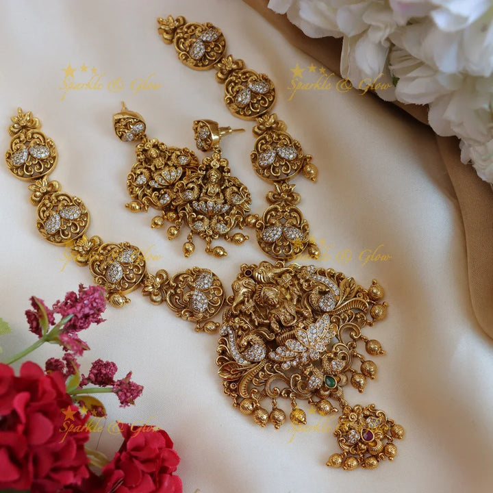 Elegant lakshmi and peacock design short necklace with cz stone - gold - Sparkle and Glow