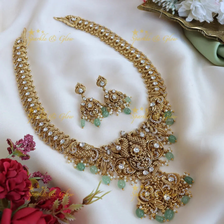 Elegant peacock and floral design long necklace with pearl and mint green beads - Sparkle and Glow