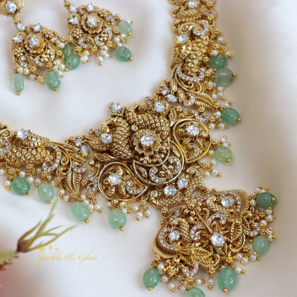 Elegant peacock and floral design long necklace with pearl and mint green beads - Sparkle and Glow
