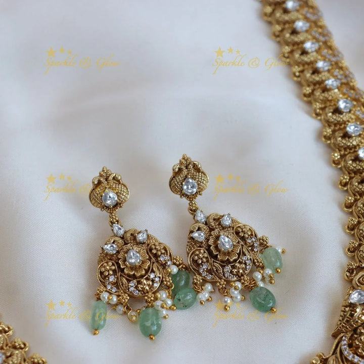 Elegant peacock and floral design long necklace with pearl and mint green beads - Sparkle and Glow