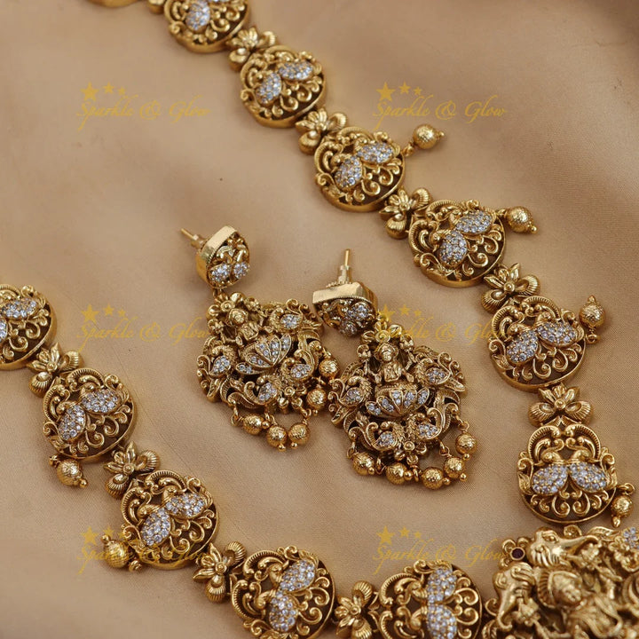 Elegant lakshmi and peacock design long necklace with cz stone - gold - Sparkle and Glow