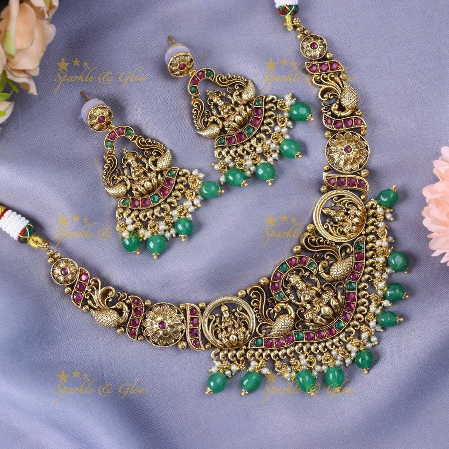 Stunning Idol Lakshmi Peacock carved short necklace with Kemp stones - Sparkle and Glow