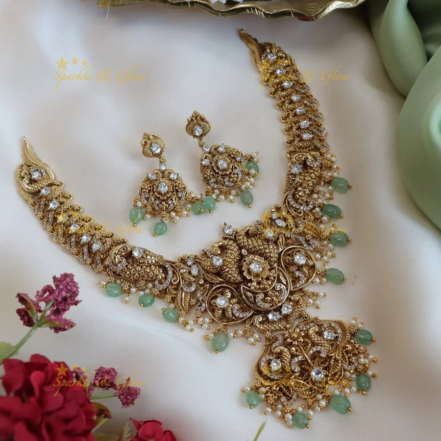 Elegant peacock and floral design short necklace with pearl and mint green beads - Sparkle and Glow