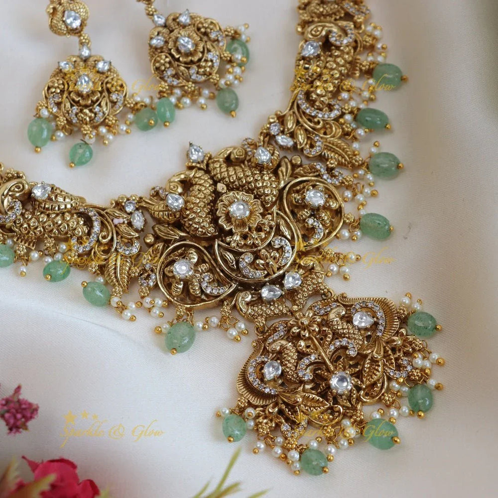Elegant peacock and floral design short necklace with pearl and mint green beads - Sparkle and Glow