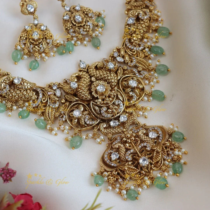 Elegant peacock and floral design short necklace with pearl and mint green beads - Sparkle and Glow