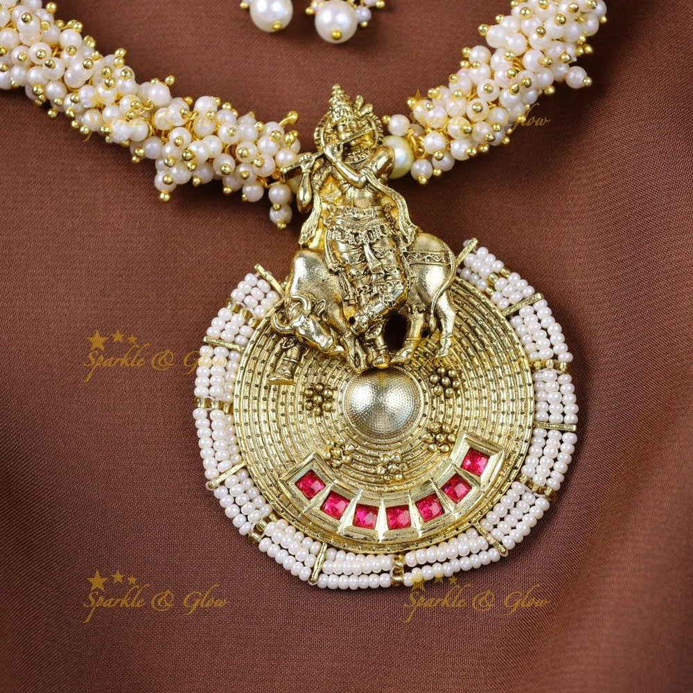 Elegant Idol Flute Krishna pendant carved pearl cluster short necklace - Sparkle and Glow