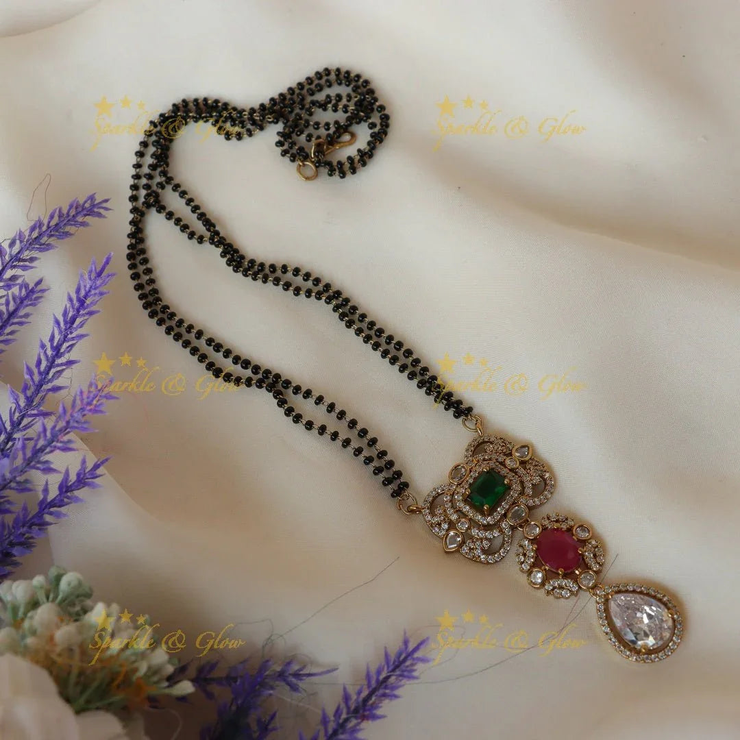 Pretty green red and white stones pendant mangalsuthra / black beads chain - Sparkle and Glow