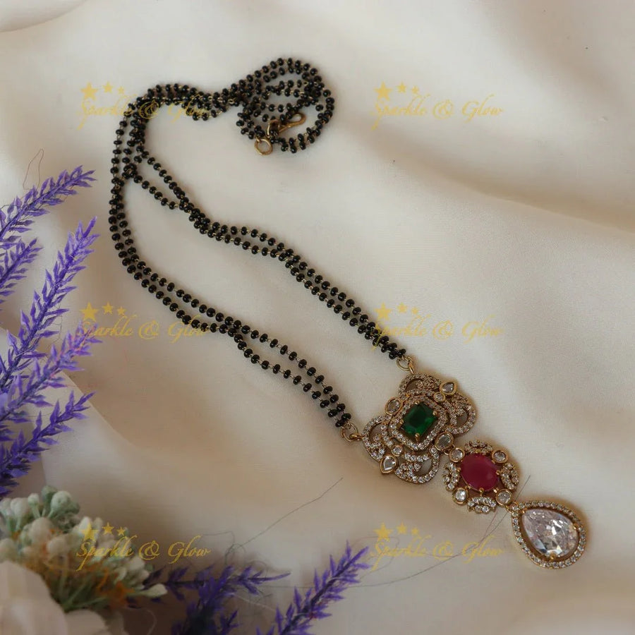 Pretty green red and white stones pendant mangalsuthra / black beads chain - Sparkle and Glow