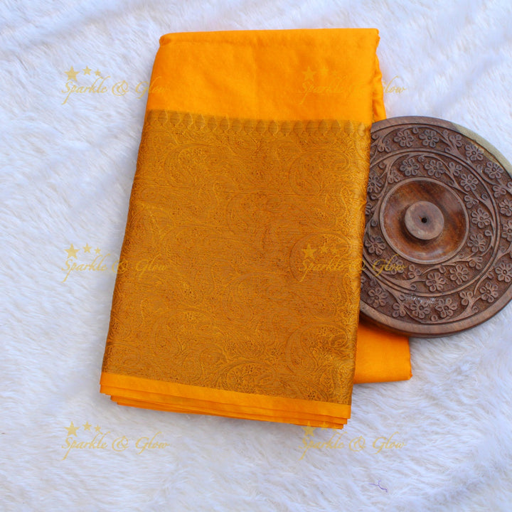 Simple and elegant yellow colour banarasi silk saree with blouse piece