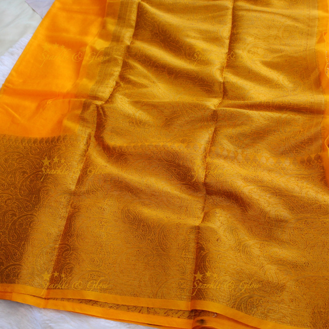 Simple and elegant yellow colour banarasi silk saree with blouse piece