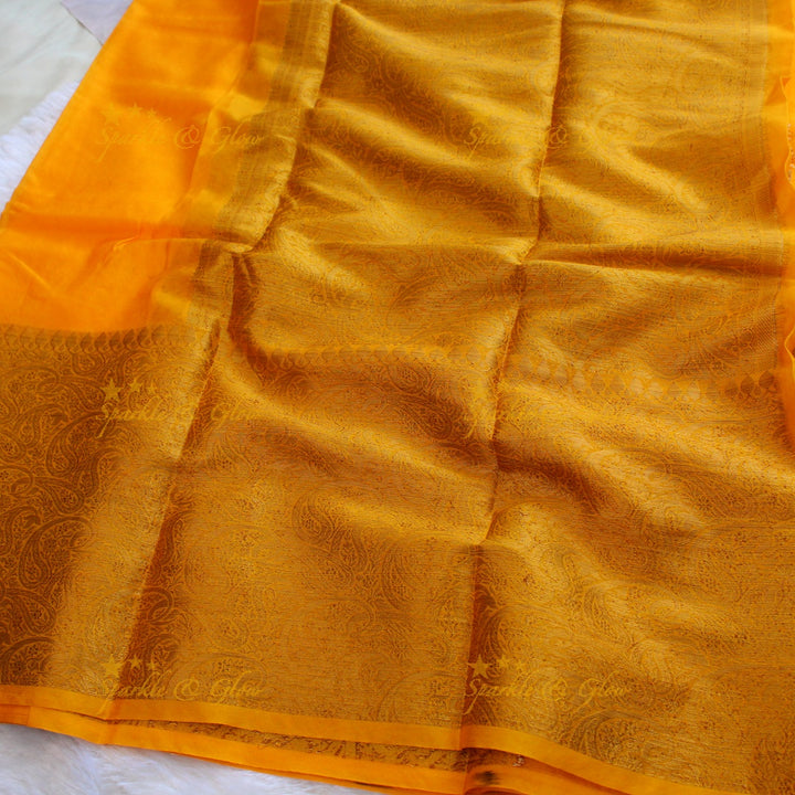 Simple and elegant yellow colour banarasi silk saree with blouse piece