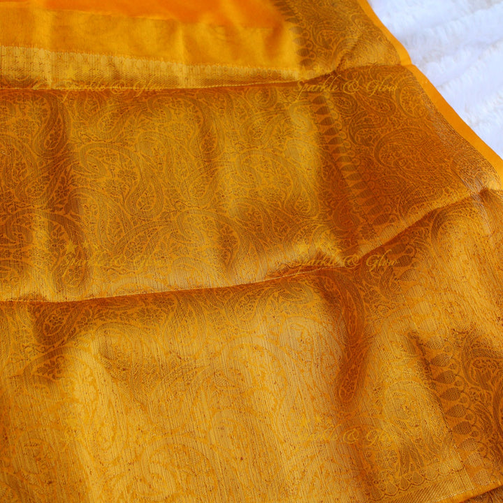 Simple and elegant yellow colour banarasi silk saree with blouse piece