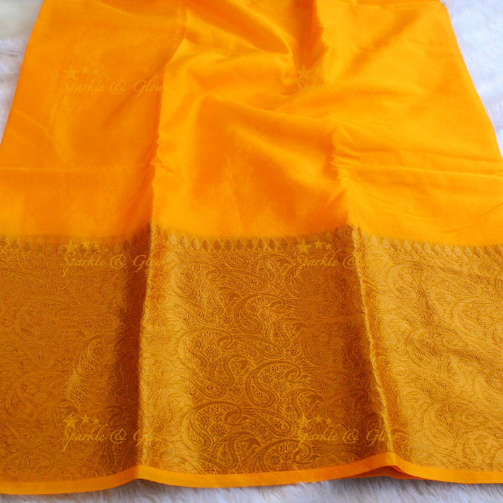 Simple and elegant yellow colour banarasi silk saree with blouse piece
