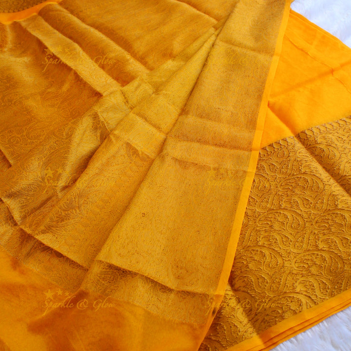Simple and elegant yellow colour banarasi silk saree with blouse piece