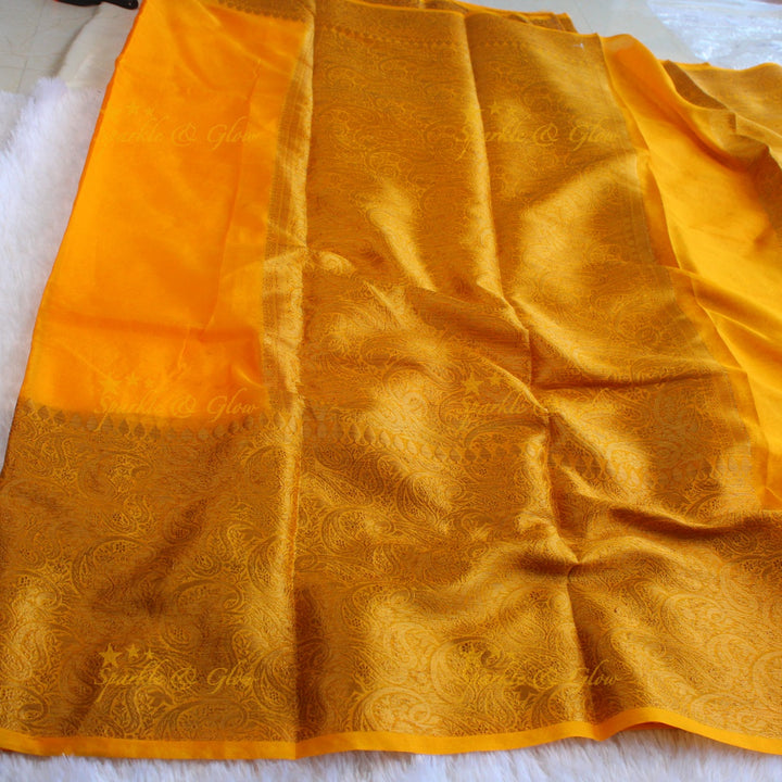 Simple and elegant yellow colour banarasi silk saree with blouse piece