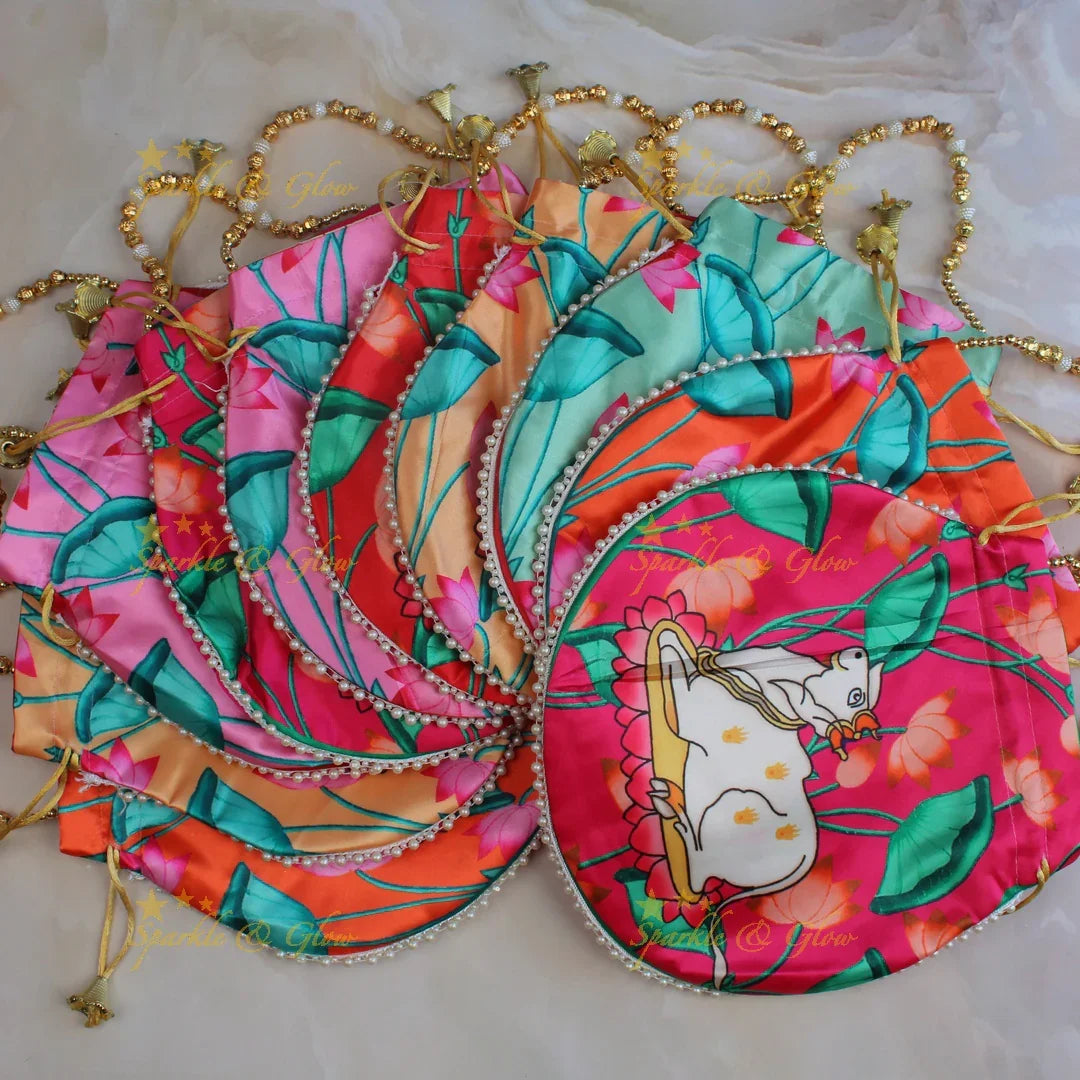 Pretty nandi print potli bags with gold beads - set of 10 - Assorted colours for return gifts - Sparkle and Glow