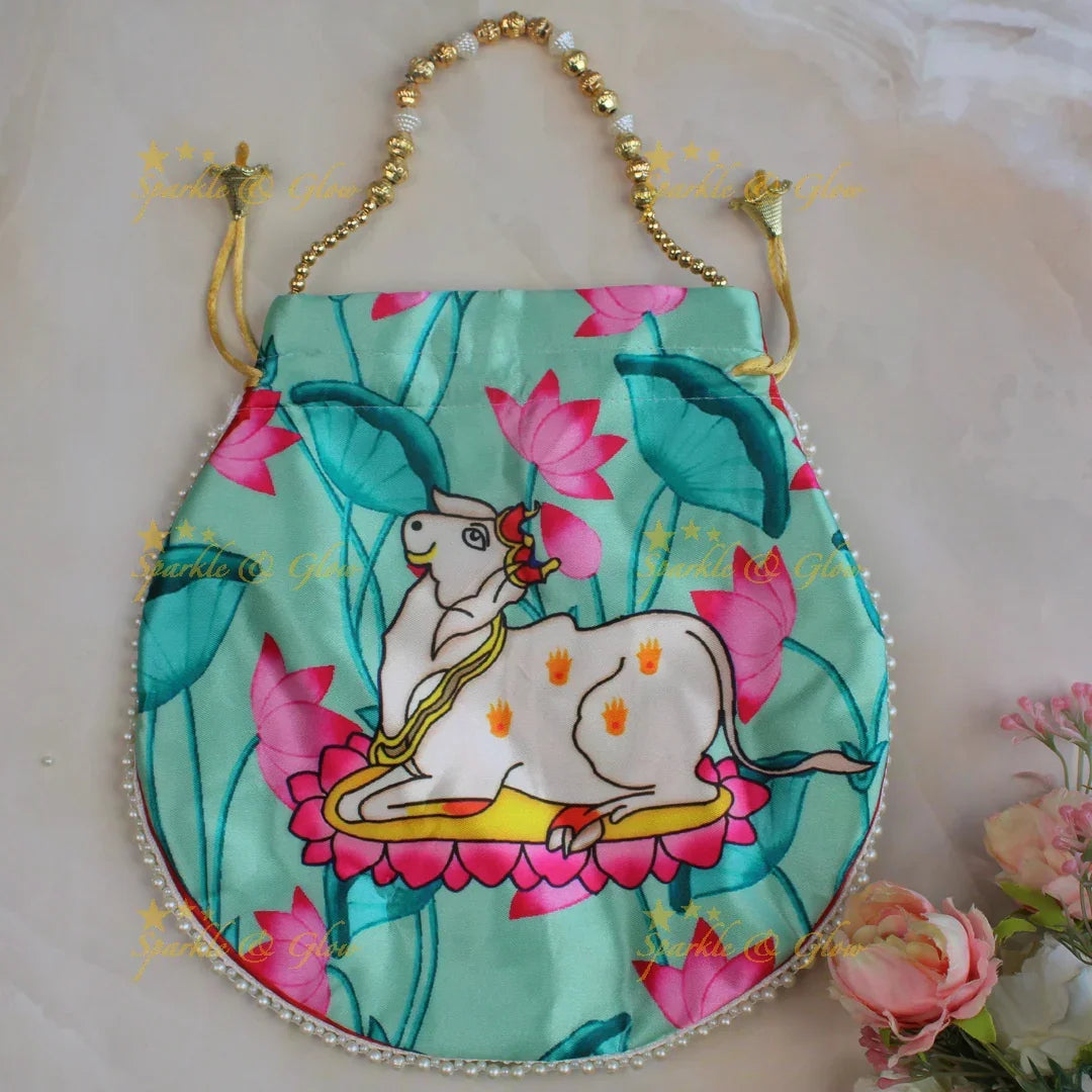 Pretty nandi print potli bags with gold beads - set of 10 - Assorted colours for return gifts - Sparkle and Glow