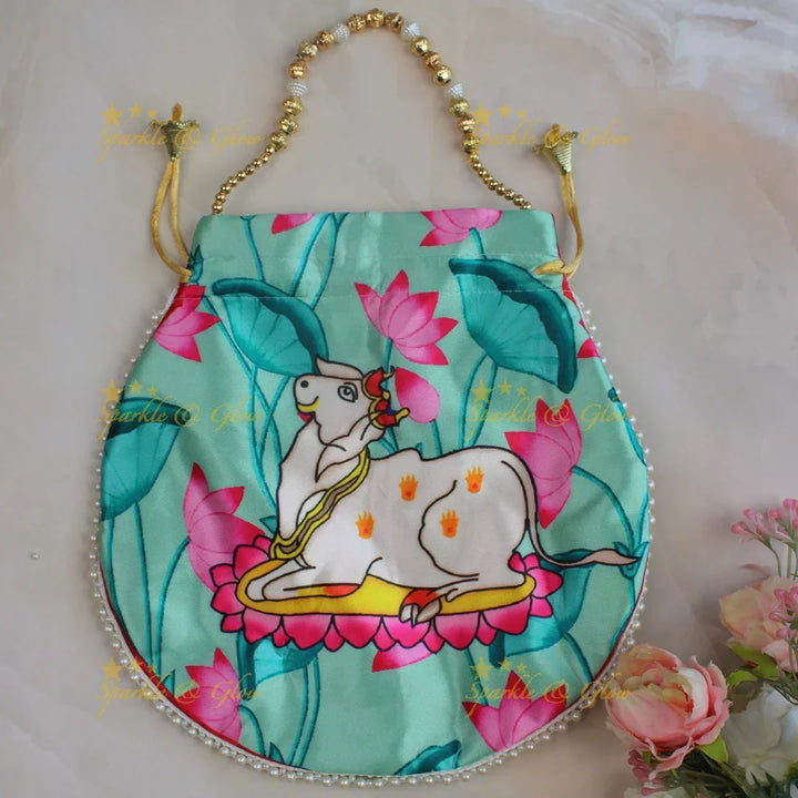 Pretty nandi print potli bags with gold beads - set of 10 - Assorted colours for return gifts - Sparkle and Glow